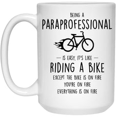 Funny Being A Paraprofessional Is Easy It's Like Riding A Bike Except Coffee Cup 15oz White 21504
