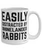 Funny Rhinelander Rabbit Mug Easily Distracted By Rhinelander Rabbits Coffee Cup 15oz White