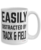 Funny Track And Field mug Easily Distracted By Track And Field Coffee Cup 15oz White