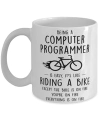 Funny Being A Computer Programmer Is Easy It's Like Riding A Bike Except Coffee Mug White