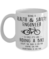 Funny Being A Health and Safety Engineer Is Easy It's Like Riding A Bike Except Coffee Mug White