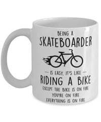 Funny Being A Skateboarder Is Easy It's Like Riding A Bike Except Coffee Mug White