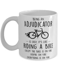 Funny Being An Adjudicator Is Easy It's Like Riding A Bike Except Coffee Mug White