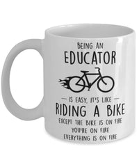 Funny Being An Educator Is Easy It's Like Riding A Bike Except Coffee Mug White