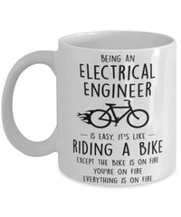 Funny Being An Electrical Engineer Is Easy It's Like Riding A Bike Except Coffee Mug White