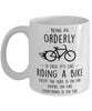 Funny Being An Orderly Is Easy It's Like Riding A Bike Except Coffee Mug White