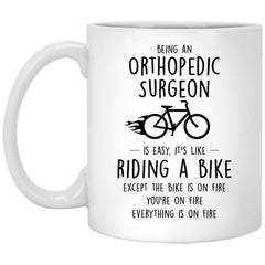 Funny Being An Orthopedic Surgeon Is Easy It's Like Riding A Bike Except Coffee Mug 11oz White XP8434