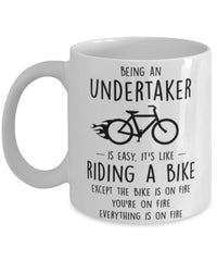 Funny Being An Undertaker Is Easy It's Like Riding A Bike Except Coffee Mug White
