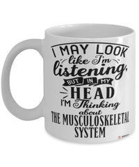 Funny Orthopedic Surgeon Mug I May Look Like I'm Listening But In My Head I'm Thinking About The Musculoskeletal System Coffee Cup White