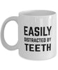 Funny Prosthodontist Dentist Orthodontist Mug Easily Distracted By Teeth Coffee Mug 11oz White