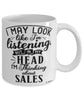 Funny Sales Representative Mug I May Look Like I'm Listening But In My Head I'm Thinking About Sales Coffee Cup White